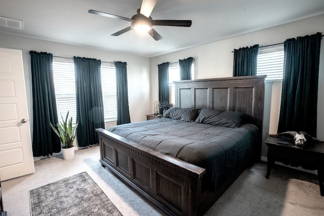 10516 Alemoor Dr, Austin, TX 78747 - bedroom featuring multiple windows, light carpet, and ceiling fan