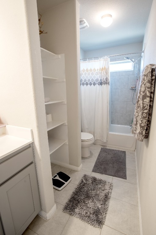 10516 Alemoor Dr, Austin, TX 78747 - bathroom with shower / tub combo, vanity, toilet, baseboards, and tile patterned floors