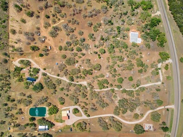 drone / aerial view featuring view of desert and a rural view