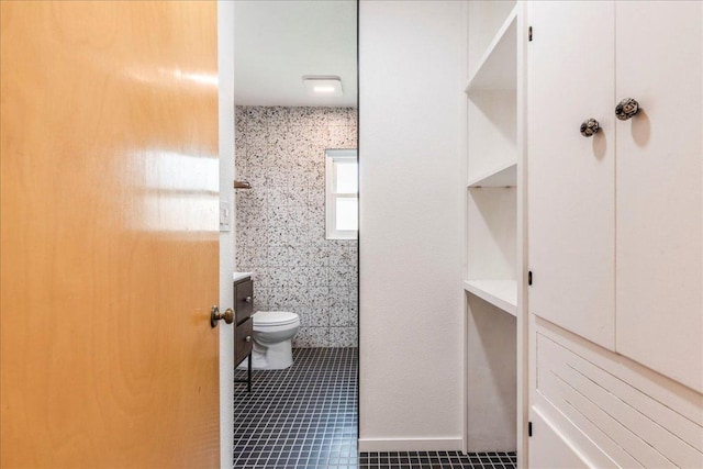 bathroom featuring tile patterned floors and toilet