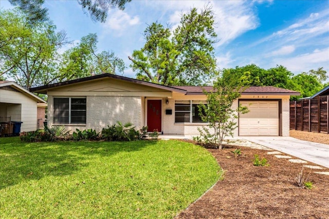 7802 Tisdale Dr, Austin, TX 78757 - single story home featuring an attached garage, concrete driveway, and brick siding
