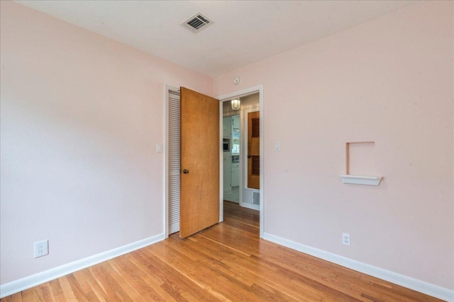 7802 Tisdale Dr, Austin, TX 78757 - unfurnished room with baseboards and light wood-style floors