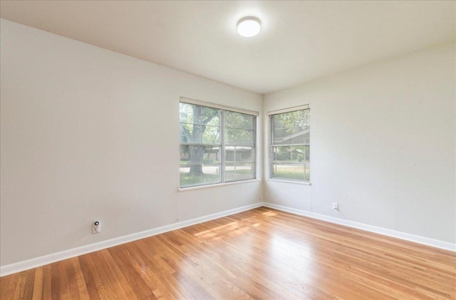 7802 Tisdale Dr, Austin, TX 78757 - unfurnished room with baseboards and light wood finished floors