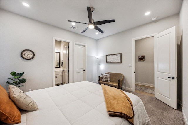 carpeted bedroom with baseboards, visible vents, recessed lighting, ceiling fan, and ensuite bath
