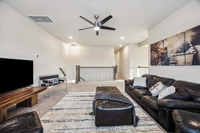 carpeted living area featuring recessed lighting, visible vents, and ceiling fan