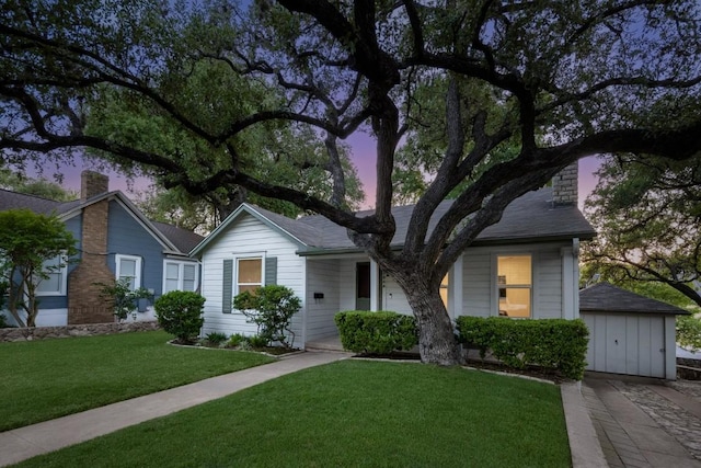 2844 Shoal Crest Ave, Austin, TX 78705 - single story home featuring a chimney, an outbuilding, a garage, and a front yard