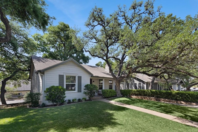 2844 Shoal Crest Ave, Austin, TX 78705 - ranch-style house with a chimney and a front yard