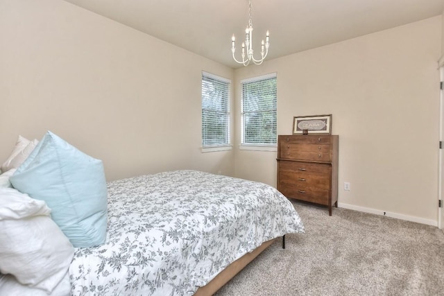 110 Chestnut Ct, Georgetown, TX 78633 - bedroom with a chandelier, light colored carpet, and baseboards