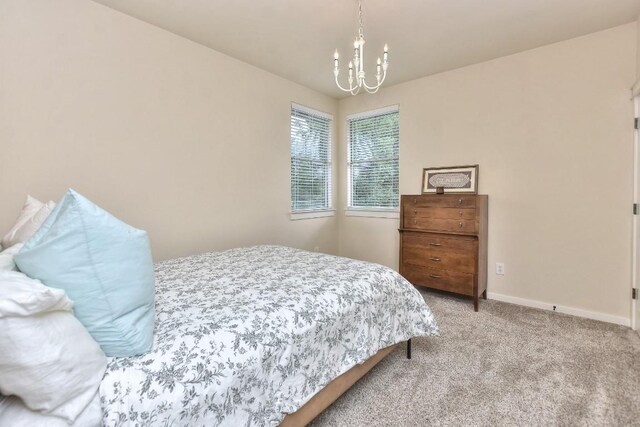 110 Chestnut Ct, Georgetown, TX 78633 - bedroom with a chandelier and light carpet