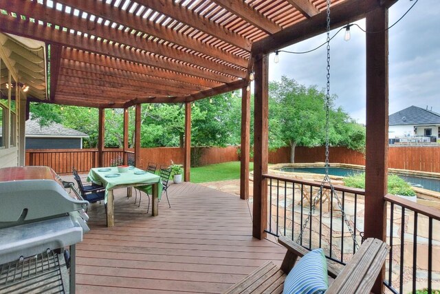 110 Chestnut Ct, Georgetown, TX 78633 - wooden deck with a fenced backyard, outdoor dining space, a pergola, and grilling area