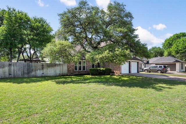 3403 NW Blvd, Georgetown, TX 78628 - view of front facade with asphalt driveway, a garage, and brick siding