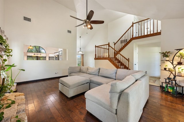 living room with high vaulted ceiling, dark wood-style floors, a ceiling fan, stairway, and baseboards