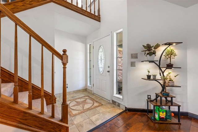 3403 NW Blvd, Georgetown, TX 78628 - foyer entrance featuring stairway, wood finished floors, and a high ceiling