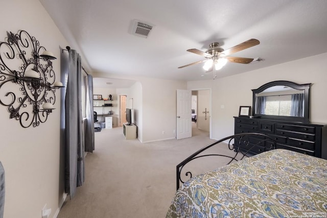bedroom with baseboards, visible vents, light colored carpet, and ceiling fan