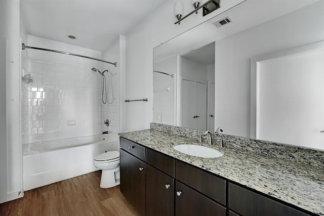1900 Barton Springs Rd Unit 4023, Austin, TX 78704 - full bathroom featuring wood finished floors, vanity, and shower / bathtub combination