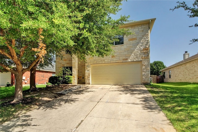 10916 Furrow Hill Dr, Austin, TX 78754 - view of front of home featuring stone siding, a garage, driveway, and a front lawn