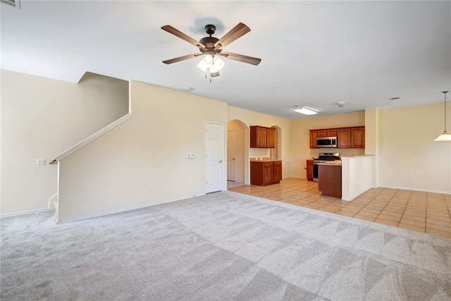 10916 Furrow Hill Dr, Austin, TX 78754 - unfurnished living room with a ceiling fan, arched walkways, light carpet, and light tile patterned flooring
