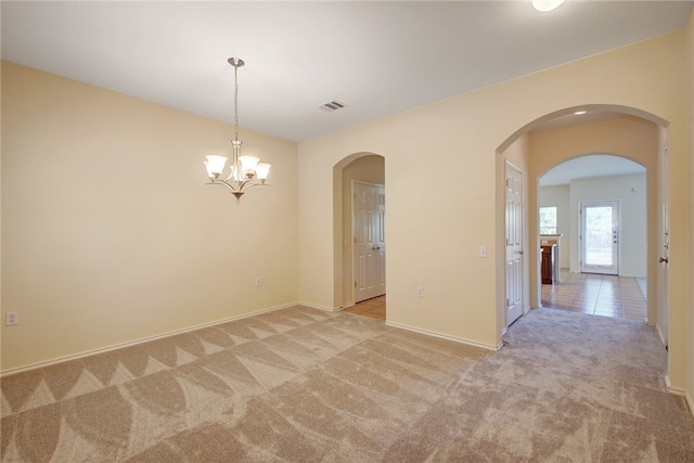 10916 Furrow Hill Dr, Austin, TX 78754 - spare room featuring light carpet, arched walkways, and a chandelier