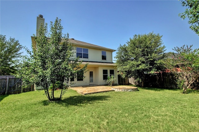 10916 Furrow Hill Dr, Austin, TX 78754 - back of house featuring a fenced backyard, a patio area, stucco siding, and a chimney
