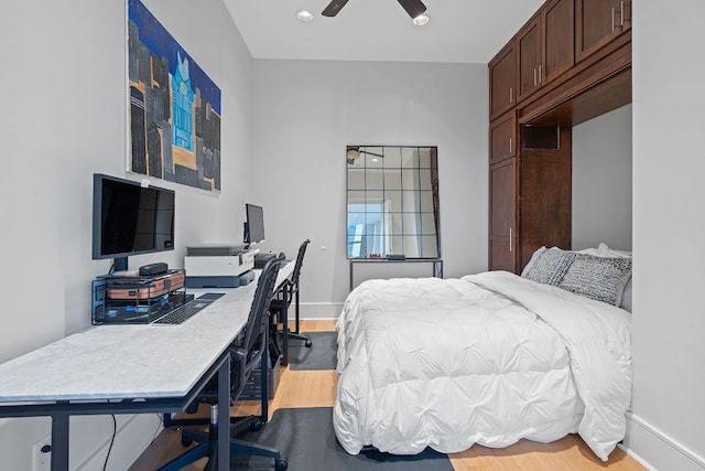 555 E 5th St Unit 2729, Austin, TX 78701 - bedroom featuring wood finished floors, a desk, baseboards, and a ceiling fan
