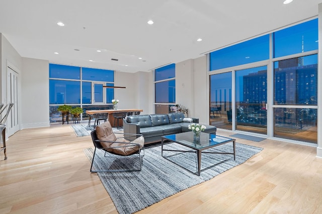 555 E 5th St Unit 2729, Austin, TX 78701 - living room featuring recessed lighting, wood finished floors, and a wall of windows