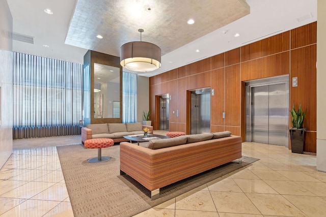 555 E 5th St Unit 2729, Austin, TX 78701 - common area with wood walls, a towering ceiling, and recessed lighting