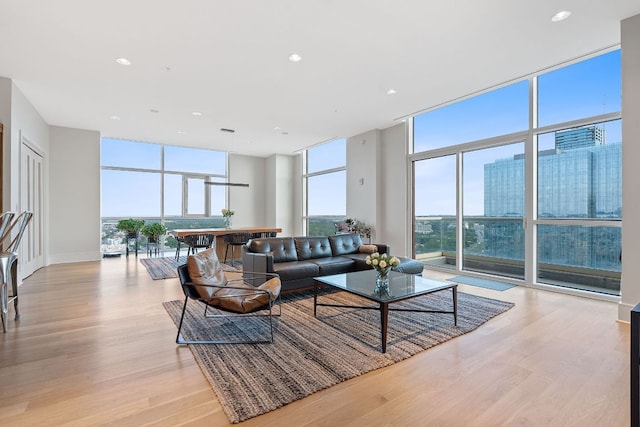 555 E 5th St Unit 2729, Austin, TX 78701 - living area with expansive windows, light wood finished floors, and recessed lighting