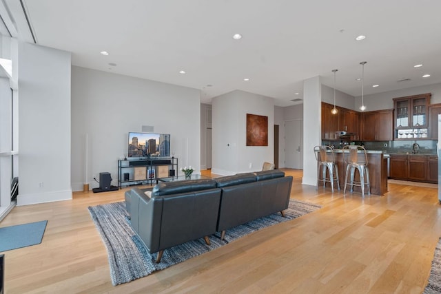 555 E 5th St Unit 2729, Austin, TX 78701 - living room featuring light wood finished floors, recessed lighting, and baseboards