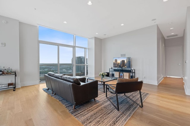555 E 5th St Unit 2729, Austin, TX 78701 - living area featuring expansive windows, light wood-type flooring, baseboards, and recessed lighting