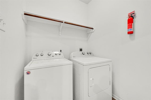 washroom with washing machine and dryer
