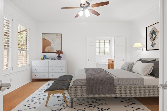 6425 Tasajillo Trl, Austin, TX 78739 - bedroom featuring wood finished floors, ornamental molding, baseboards, and ceiling fan