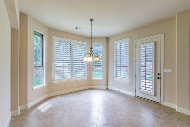 308 Angus Dr, Cedar Park, TX 78613 - unfurnished dining area with plenty of natural light, a chandelier, light tile patterned floors, and baseboards