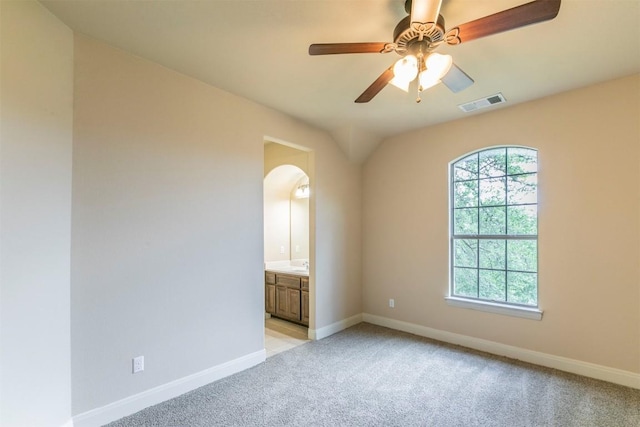 308 Angus Dr, Cedar Park, TX 78613 - empty room with light colored carpet, baseboards, arched walkways, and ceiling fan