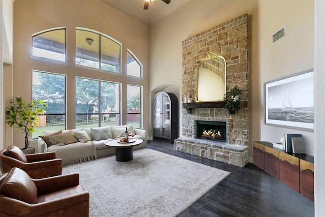 308 Angus Dr, Cedar Park, TX 78613 - living area featuring ceiling fan, dark wood-style floors, a high ceiling, and a fireplace