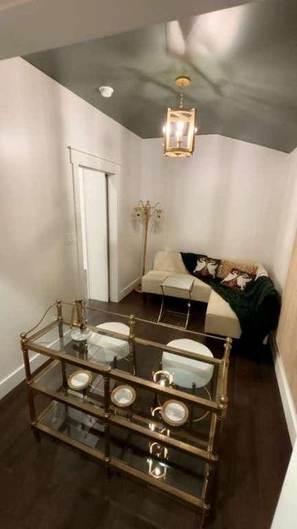 dining room featuring baseboards and dark wood-style flooring