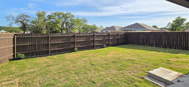 view of yard featuring a fenced backyard