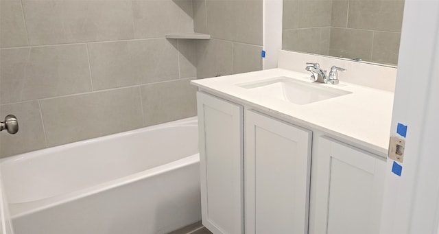 bathroom featuring a bath and vanity