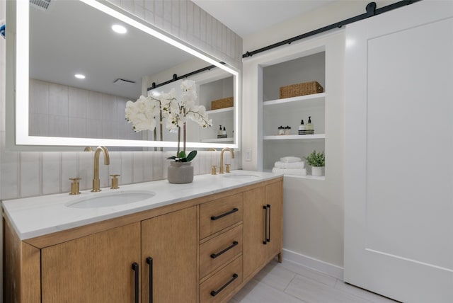 2901 Gabriel View Dr, Georgetown, TX 78628 - full bathroom with double vanity and baseboards
