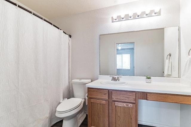 3005 Tyler Ln, Taylor, TX 76574 - bathroom with vanity, toilet, and a shower with shower curtain