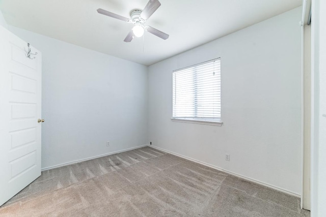3005 Tyler Ln, Taylor, TX 76574 - unfurnished room featuring carpet floors, ceiling fan, and baseboards