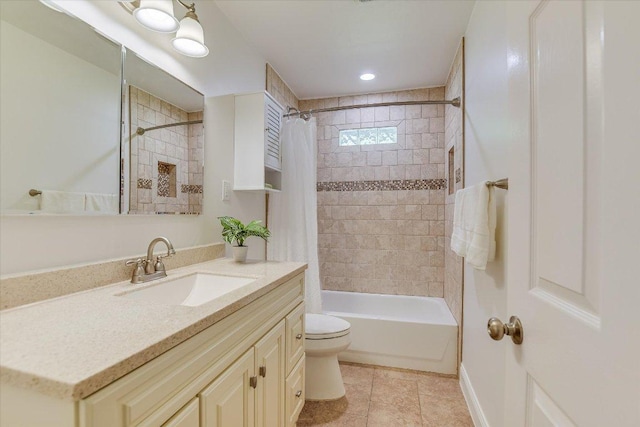 bathroom featuring shower / tub combo, toilet, vanity, and tile patterned floors