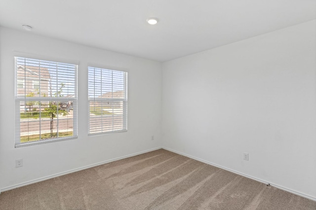 2305 Tornado Aly, Lockhart, TX 78644 - empty room featuring carpet flooring, a wealth of natural light, and baseboards