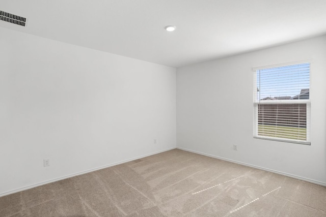 2305 Tornado Aly, Lockhart, TX 78644 - empty room with visible vents, carpet floors, and baseboards