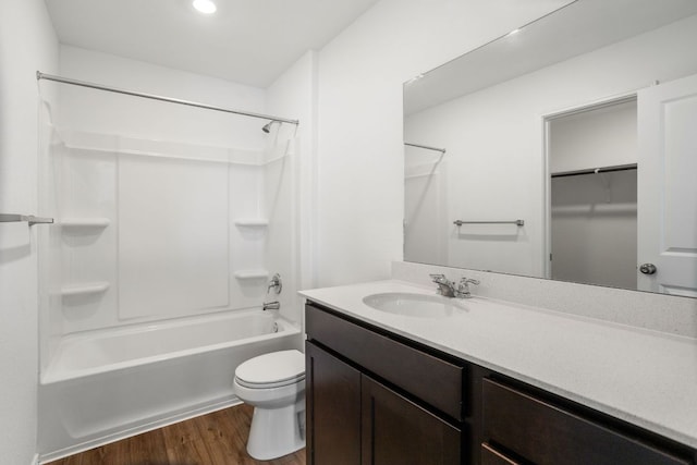 2305 Tornado Aly, Lockhart, TX 78644 - full bath with toilet, vanity, shower / tub combination, and wood finished floors