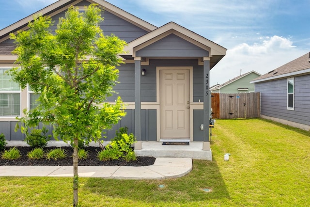 2305 Tornado Aly, Lockhart, TX 78644 - view of front of home featuring fence and a front lawn