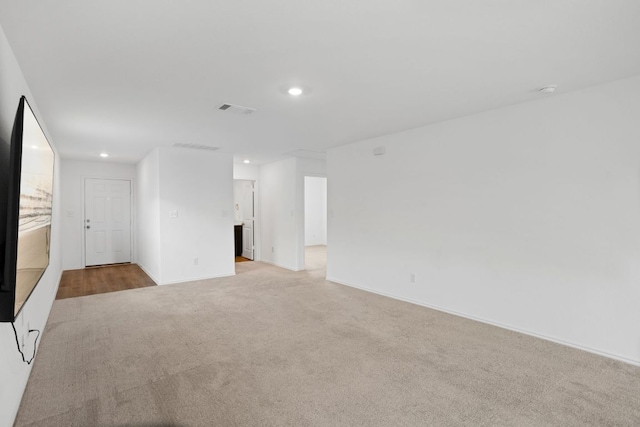 2305 Tornado Aly, Lockhart, TX 78644 - unfurnished room with visible vents, recessed lighting, light colored carpet, and baseboards