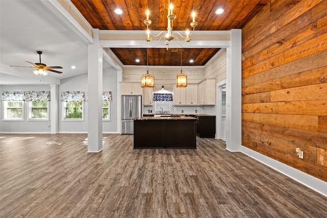 kitchen with freestanding refrigerator, a center island, open floor plan, and wooden ceiling