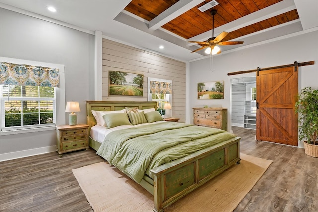 bedroom featuring wooden ceiling, visible vents, beam ceiling, and a barn door
