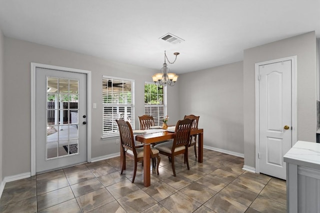 2205 Milan Dr, Cedar Park, TX 78613 - dining space featuring a chandelier and baseboards