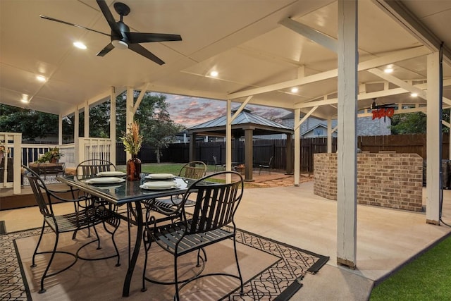 2205 Milan Dr, Cedar Park, TX 78613 - fenced backyard with a gazebo, a patio, outdoor dining area, and ceiling fan